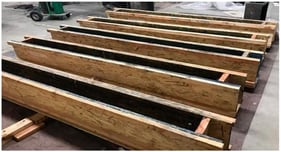 Prepared wooden formwork for concrete beams.