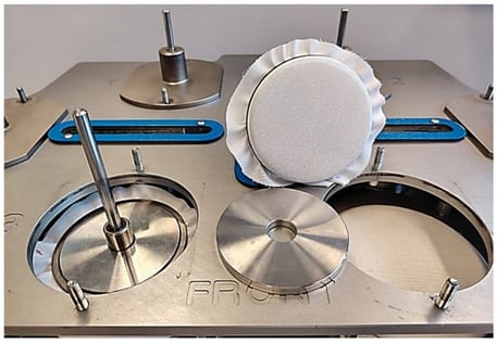Induction of surface pilling on viscose fabric specimens by rubbing against standard wool abradant fabric using the Martindale pilling tester 2561 E, Mesdan S.p.A., Raffa, Italy.