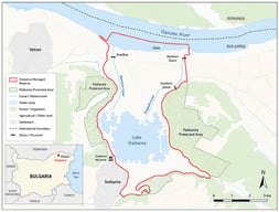 Location of Lake Srebarna in northeastern Bulgaria and schematic map of the Managed Reserve, showing the main open-water bodies, canals, hydraulic structures, protected areas, and nearby settlements.