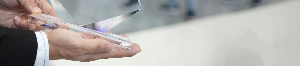 A person holding an award